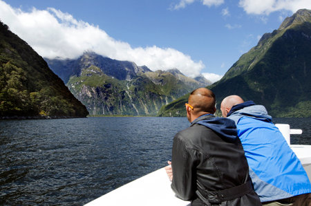 MILFORD SOUND,NZ - JAN 14:Visitors sail in Milford Sound on Jan 14 2014.It has been judged the world's top travel destination in the 2008 Travelers Choice Destinations Awards by TripAdvisor.のeditorial素材