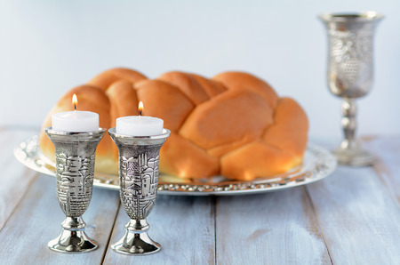 Shabbat candles with Challah bread and wine cupの写真素材