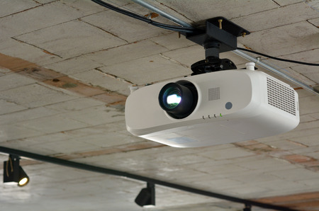 Video projector hanged on the celling.の写真素材