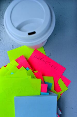 Post it notes and a cup of coffee. Marketing conceptの写真素材