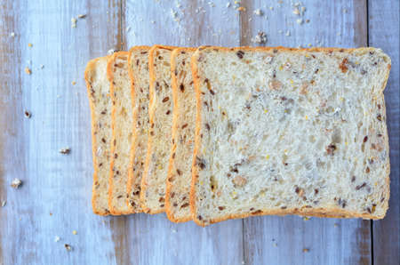 Flat lay of fresh sliced bread. Food background and texture with copy spaceの写真素材