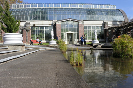 AUCKLAND - JULY 24 2016:People visit in Auckland Wintergardens.View of the tropical hot house of the Wintergardens from the temperate house.のeditorial素材