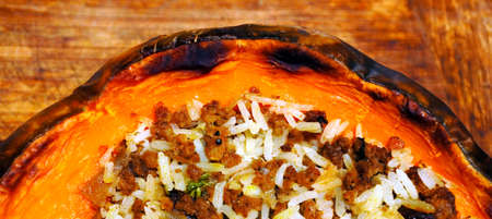 Flat lay view of Stuffed pumpkin with rice and mince. Food background. copy spaceの写真素材