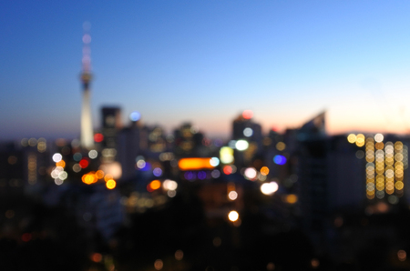 Bokeh (out-of-focus) of Auckland skyline during the blue hour of the sunrise. Travel New Zealand, background with copy spaceの写真素材