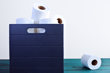 One toilet paper out of the toilet papers box. Standing out from the crowd. copy spaceの写真素材