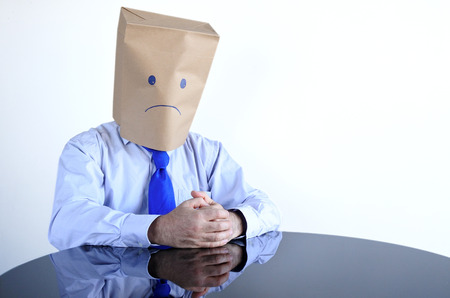 Anonymous sad man sit at the table alone. Man lifestyle, sadness concept. copy spaceの写真素材