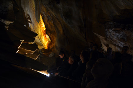 Unrecognisable people visiting inside the Jenolan Caves at Blue Mountains of New South Wales, Australia.のeditorial素材