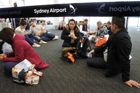 SYDNEY, Australia - OCT 24 2016: Passengers wait for a delayed flight at Sydney Airport Sydney, Australia. It is the busiest airport in Australia, handling 35,630,549 passengers in 2011 and 326,686 aircraft movements in 2013.のeditorial素材