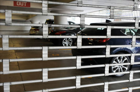 Secured car park with metal gate.