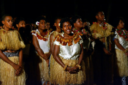 SAVUSAVU, FIJI - DEC 22 2017: Indigenous Fijian people sing and dance a traditional Fijian dance. Real people copy spaceのeditorial素材