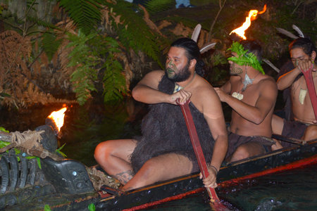 ROTORUA, NZL - APR 25 2017:Maori men in traditional waka boat.Maori are the indigenous people of New Zealand that migrated to New Zealand from Polynesia1000 years ago.のeditorial素材