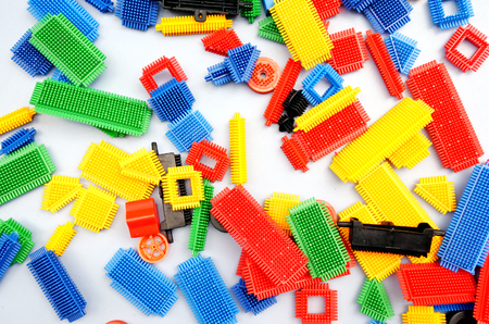 Flat lay view of colourful connection elements on white backgroundの写真素材