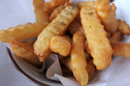 Crinkle potato fries. Food background. and texture. Copy spaceの写真素材