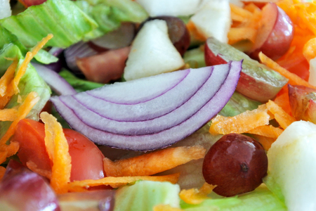 Fresh mixed vegetables fruit salad. Vegetarian food background and texture.の写真素材