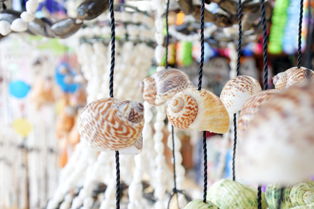 Exotic snail shells mobile  for sale in Rarotonga Cook Islands. Abstract backgrounds and texture.の写真素材