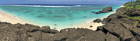 Panoramic landscape view of Black Rock Beach in Rarotonga, Cook Islands.の写真素材
