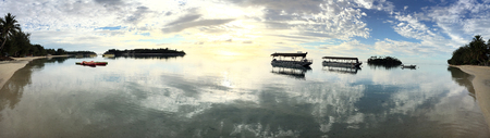 Dramatic panoramic landscape view of Muri lagoon at dawn in Rarotonga Cook Islandsの写真素材