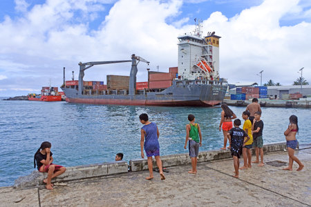 RAROTONGA - DEC 13 2017:Cook Islanders youth hang out in Port of Avatiu.The demographics statistics population of the Cook Islands between the ages 15ï¿½24 years is 17.64% (male 929/female 806)のeditorial素材