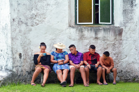 RAROTONGA - DEC 18 2017:Cook Islanders youth hang out outside Avarua CICC church. The demographics statistics population of the Cook Islands between the ages 15ï¿½24 years is 17.64% (male 929/female 806)のeditorial素材