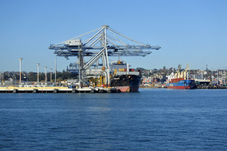 AUCKLAND - JULY 12 2018:Freight ship in Ports of Auckland.Visited by about 1,600 commercial vessels a year its New Zealands largest commercial port handling more than NZ$20 billion of goods per yearのeditorial素材