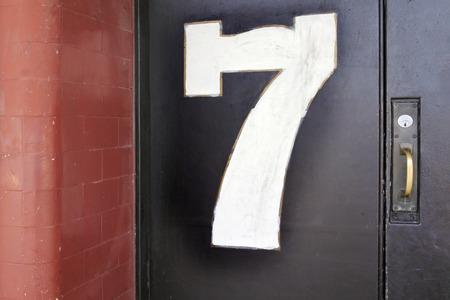 Door number seven 7 background.Since the dawn of time, the number 7 has had a special place in most civilizations as a magical beneficial and protective number.の写真素材