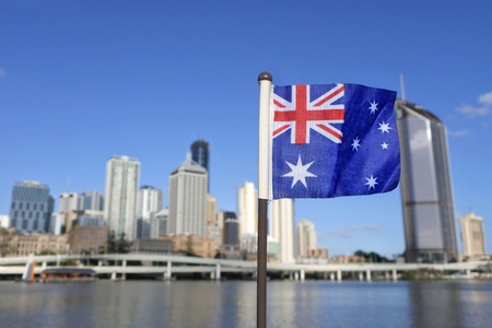 The Australian flag against Brisbane the capital city  of Queensland, Australia.の写真素材