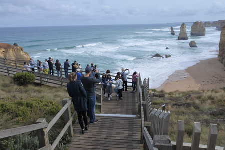 Melbourne, Australia - April 19 2019: Tourists at Port Campbell National Park, looking at the Twelve Apostles along the Great Ocean Road in Victoria, Australia.のeditorial素材