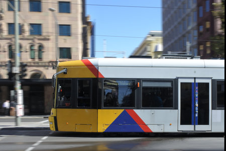 Adelaide, Australia - March 29 2019: Adelaide city tram in blurry motion. Adelaide Metro provides a...