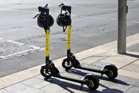 Adelaide, Australia - May 06 2019: Two Ride E-scooters in Adelaide city, South Australia. To ride an...