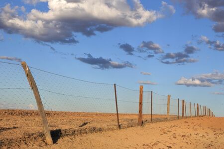 Dingo Fence near Coober Pedy in South Australia Outback.It is one of the longest structures in the world with total Length of 5,614 km.の写真素材