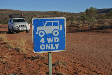 Four wheel drive vehicle driving on a 4 WD only road during a road trip in central Australia red center outback. Most of the roads in Australia outback are unsealedのeditorial素材