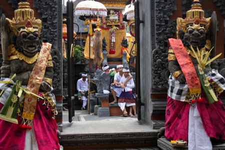Ubud, Bali, Indonesia - July 24 2019:Balinese family celebrating Galungan Kuningan holidays in a family temple in Ubud Bali, Indonesia.のeditorial素材