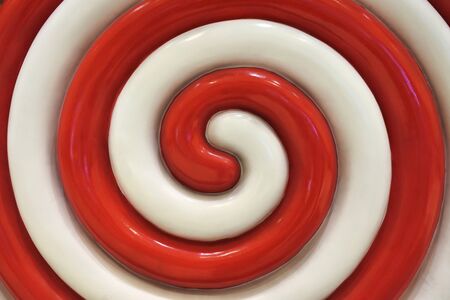 Red and white lollipop swirl abstract background and texture.の写真素材