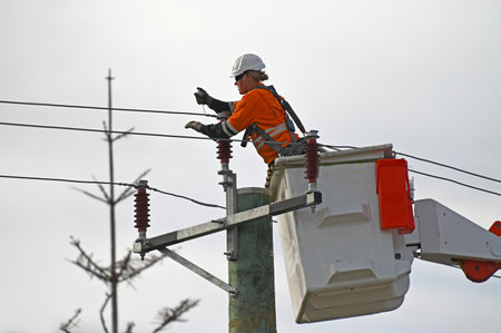 PERTH - JUNE 09 2020:Australian female electricity worker fixing power line. Women comprise 47.0% of all employed persons in Australiaのeditorial素材