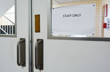 Staff only sign on hospital door. Healthcare and Medicine concept.No people. Copy spaceの写真素材