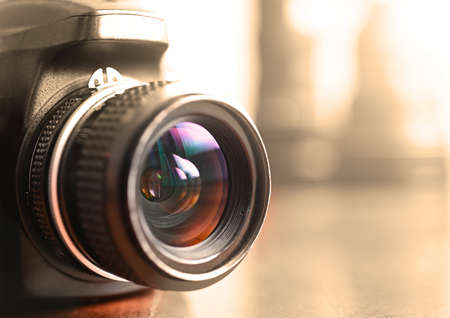 Close up of camera lens and photography equipment on a wooden table.の写真素材