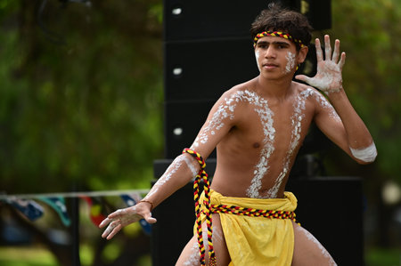 PERTH - JAN 24 2021:Aboriginal Australians man dancing traditional dance during Australia Day...