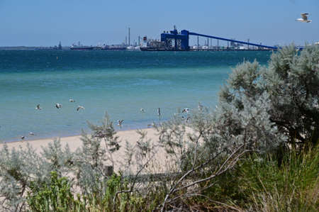 ROCKINGHAM, WA - JAN 14 2022:Kwinana Grain Terminal, Western Australia's primary grain export facility, shipping more than half of the state's export grain with storage capacity of one million tonnes.の写真素材