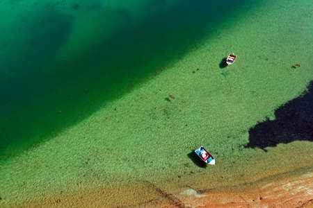 Aerial view of two fishing boats mooring on turquoise water at Peron Peninsula in Shark Bay, Western Australia.の写真素材