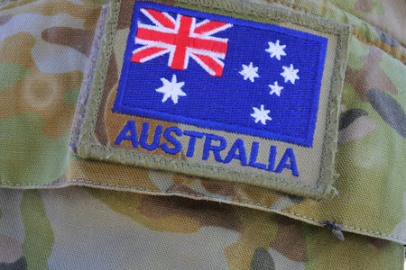 CARNARVON, WA - MAY 07 2022:Australian Army flag on military camouflage uniform.Since 1947, the Australian Army has been involved wars and conflicts, usually under the auspices of the United Nations.のeditorial素材