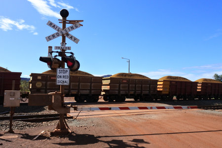 TOM PRICE,WA - JUNE 11 2022:Rio Tinto's iron ore train cars journey on the world's largest private rail network with over 1400km of tracks connecting mines at Tom Price with Dampier and Port Lambertのeditorial素材