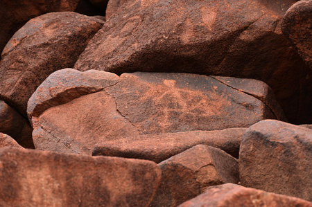 DAMPIER, WA - JUNE 07 2022: Aboriginal Petroglyphs on rocks.There are more than 1m catalogued petroglyphs dating back  thousands of years on the peninsula and Dampier archipelago in Western Australia.のeditorial素材