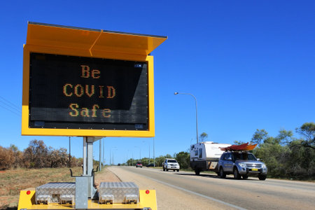 BROOME, WA - JULY 07 2022:Be COVID Safe traffic sign.As of 3 August 2022, Australia had administered 62,492,656 vaccine doses across the country.のeditorial素材