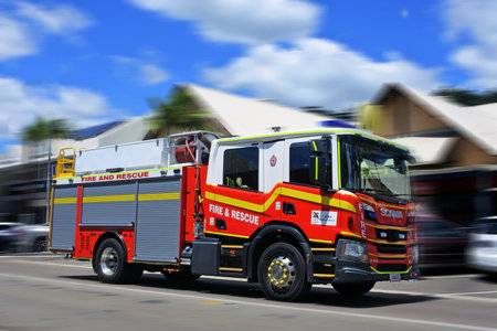 AIRLIE BEAH, QLD - OCT 02 2022:Australian firetruck rushing to scene.The global fire trucks market...