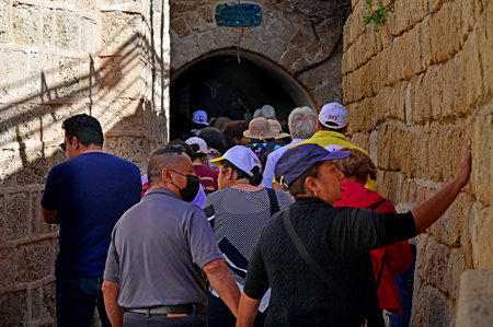 TEL AVIV JAFFA - NOV 23 2022:Tourists in Jaffa city, an ancient port city known for its association with the biblical stories of Jonah, Solomon, Saint Peter as well in mythological story of Andromeda.のeditorial素材