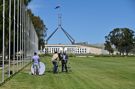 CANBERRA, ACT - MAR 16 2023:Outside broadcasting television crew covering political news in Canberra Capital Hill Parliament House. In 2022 around 42 percent of Australian accessed news via televisionのeditorial素材