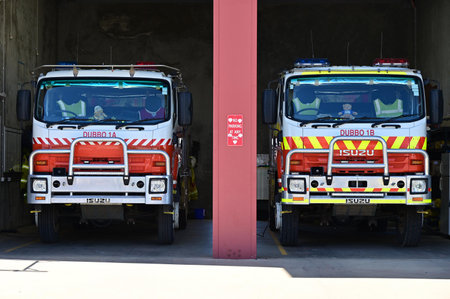 DUBBO, NSW -  MAR 07 2023:Two firefighters engine trucks on standby allert.The two leading causes of...