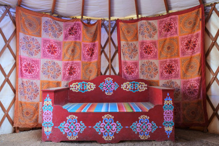 Living room of a a traditional Mongolian yurt ger a portable, round tent covered and insulated with skins or felt and traditionally used as a dwelling by nomadic groups in Central Asia Mongolia.の写真素材