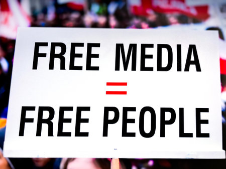 Free media equals free people sign background.