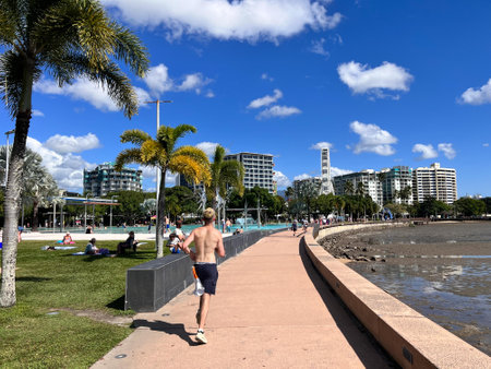 CAIRNS - MAY 28 2023:Cairns Esplanade.The picturesque palm-fringed waterfront has a swimming lagoon, parklands, playgrounds, and barbecues, all of which is free and available for public use.のeditorial素材